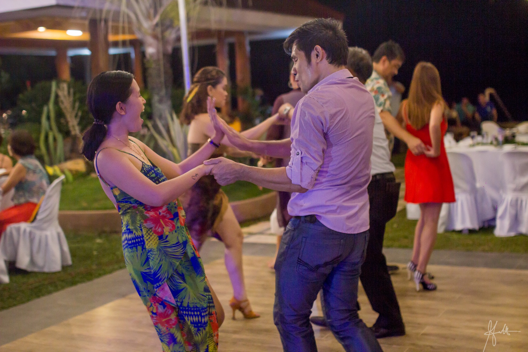 Guests enjoying the dance floor at an evening event