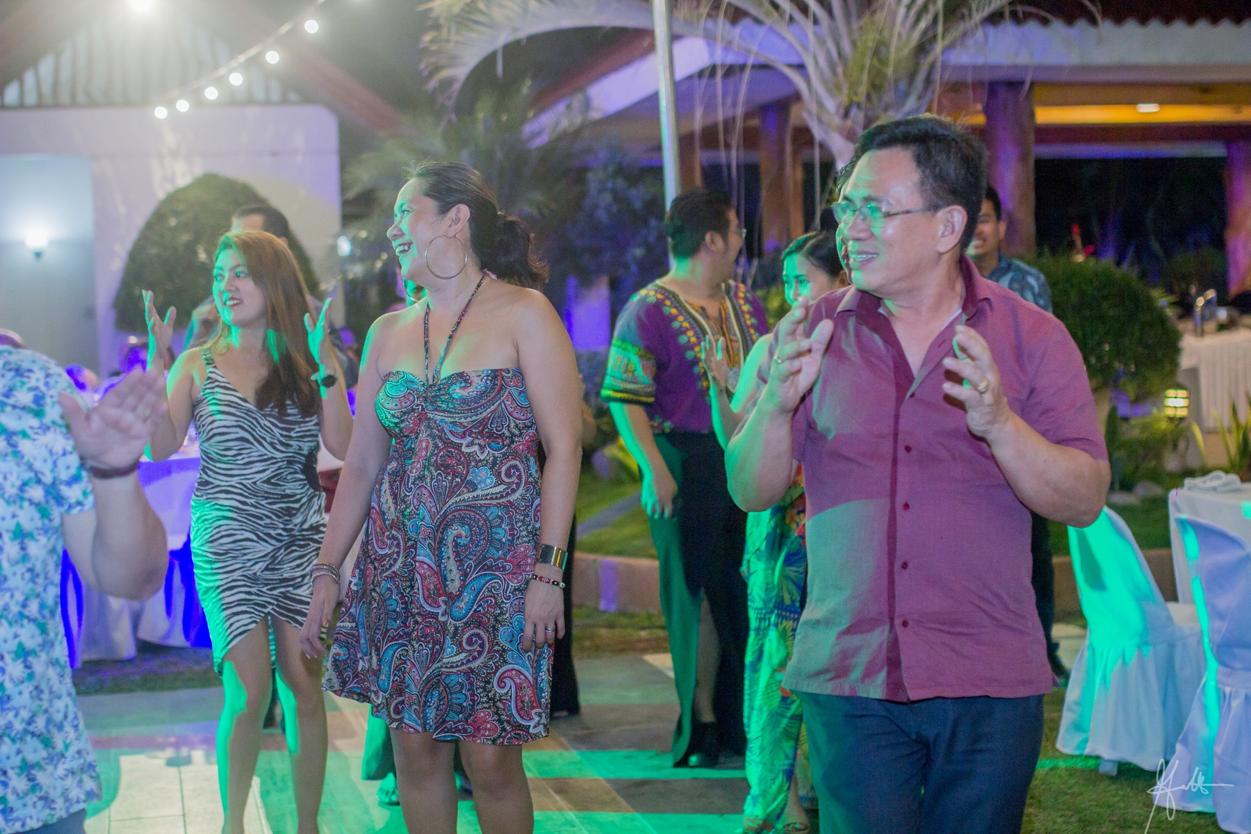 Guests singing and dancing during a reception