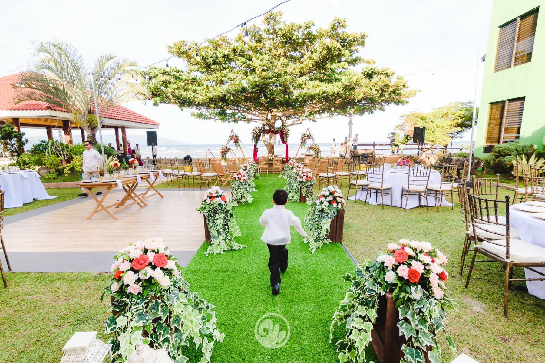 Garden ceremony aisle with the sea in the distance